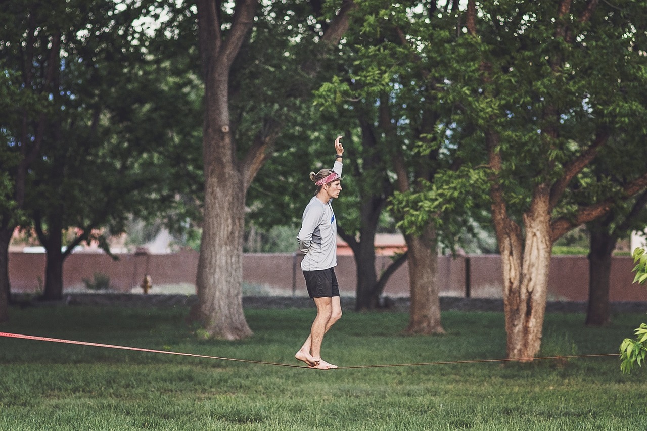 Tight rope walker in a park.